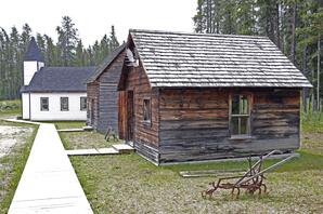 Church, Two Cabins and Cultivator