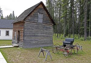 Exterior of Lob Cabin with Buggy