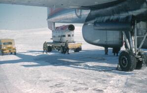 Off-load of a helicopter fuselage from a military (RCAF) C-119 Box-Car