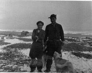 Inuit couple with dog