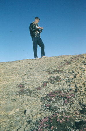 John Gilbert holding a camera
