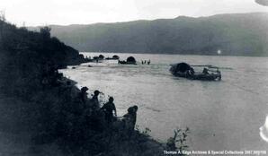 Numerous boats and people on a shoreline, [Alberta].