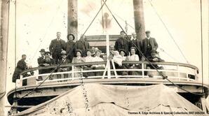 People on a ship, Fort Chippewyan. A note on the back reads: ""Passengers leaving for Edmonton aboard SS. Graham; Fort Chippewyan"".