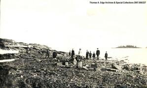 Portrait of people standing on a shoreline, Sandy Bay.