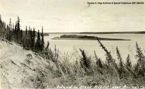 Views from a hilltop of a body of water and an island, [Alberta]. Note on the front reads"" ""Island in Slave River near Boundary"".