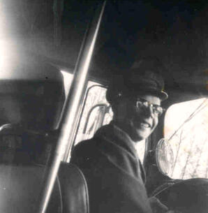 Albert Karvonen driving the bus he owned and operated