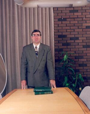 Dominque Abrioux in President's boardroom, Athabasca, Alberta