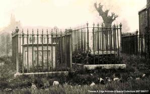 Gravestones surrounded by an ornate metal fence, [Alberta]. Note on back of photograph reads "Watts and Granny and Granddaddy graves".