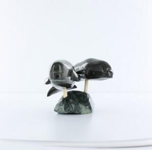 Two Narwhal on Rock