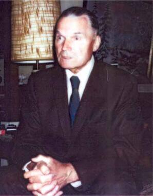 Man in Black suit with Blue tie