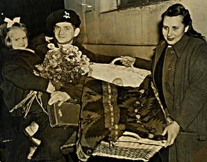 Baiba Kundrats and her parents Ruth and Aleksanders Kundrats at train station