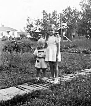 Baiba and Uldis Kundrats standing on sidewalk