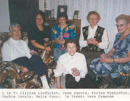 A Group of Women Holding Wax Flowers