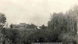 Wooden Church in Summer Clearing with White Tents, Alberta