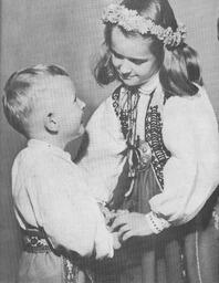 Baiaba and Uldis Kundrats chidren wearing tradtional Latvian clothing
