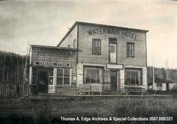 One wooden structure with two businesses, a General Store, and Waterways Hotel and Waterways Café, [Alberta].